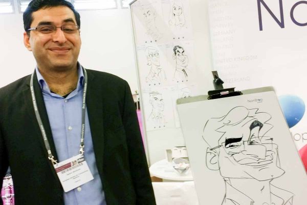 Schnellzeichner auf Messe, Karikatur auf Papier