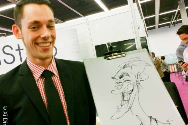 Schnellzeichner auf Messe, Karikatur auf Papier