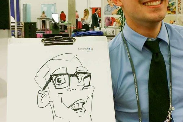 Schnellzeichner auf Messe, Karikatur auf Papier