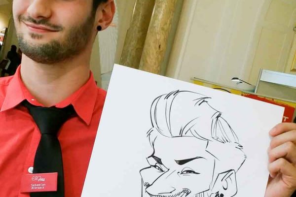 Schnellzeichner auf Messe, Karikatur auf Papier