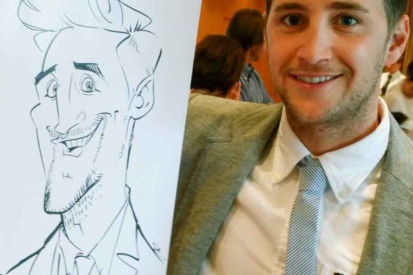 Schnellzeichner auf Messe, Karikatur auf Papier