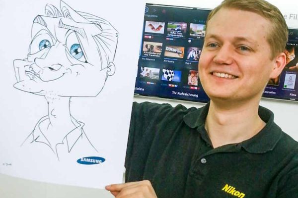 Schnellzeichner auf Messe, Karikatur Digital