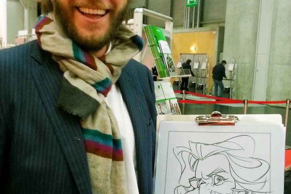 Schnellzeichner auf Messe, Karikatur auf Papier